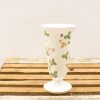 Elegant ceramic vase with floral patterns, perfect for enhancing any decor style.