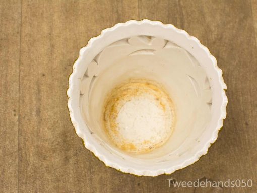 Elegant white ceramic pot with scalloped edge, perfect for decoration or plants.