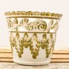 Elegant ceramic pot with olive green design, scalloped edge, perfect for decor or plants.