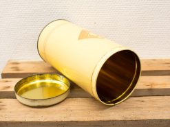 Vintage yellow storage container with a golden lid, perfect for nostalgic home decor.
