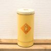 Vintage yellow tin canister featuring a playful chef illustration for charming kitchen storage.