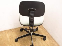Modern ergonomic office chair with stylish black backrest and light gray upholstery for optimal comfort.