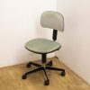 Light green vintage office chair with adjustable backrest for comfort and style.