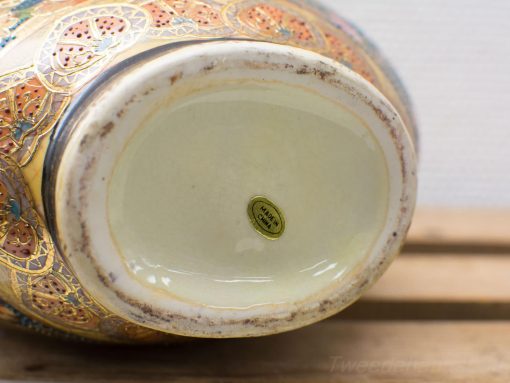 Elegant Chinese ceramic vase with vibrant floral and geometric patterns, perfect for decor.