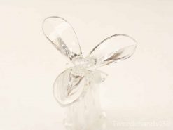 Elegant glass sculpture resembling a flower or butterfly, perfect for modern decor.