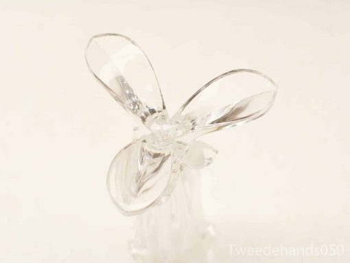 Elegant glass sculpture resembling a flower or butterfly, perfect for modern decor.
