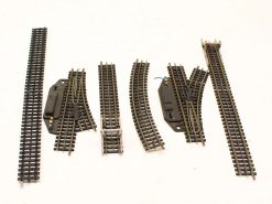 Versatile model railroad track set with straight, curved, and switch components for customization.