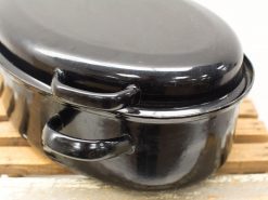 Glossy black cast iron casserole with lid, perfect for cooking and serving hearty meals.