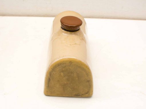 Vintage ceramic bottle with unique design, perfect for décor and adding charm to any space.