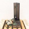 Vintage 1950s blood pressure meter, retro medical device with chrome dial and flexible tubing.