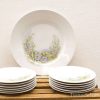 Elegant vintage dinnerware set with floral designs, perfect for special occasions and display.