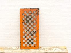 Vintage orange kitchen grater with rustic charm, perfect for adding a nostalgic touch to kitchens.