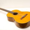 Stunning vintage acoustic guitar with unique woodwork and classic design details.