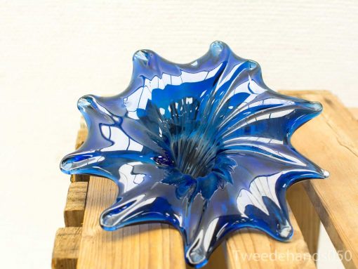 Stunning blue glass art bowl with organic design and elegant, wavy edges. Unique vintage piece.