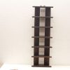 Sleek dark wood display shelf with minimalistic design and functional hooks for stylish organization.