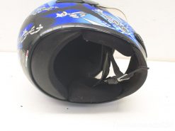 Stylish black and blue motorcycle helmet with cartoon designs, blending safety and fun for riders.