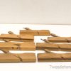 Rustic wooden clamps for woodworking, showcasing craftsmanship and history—ideal for collectors and artisans.
