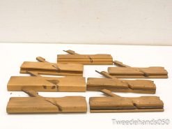 Rustic wooden clamps for woodworking, showcasing craftsmanship and history—ideal for collectors and artisans.