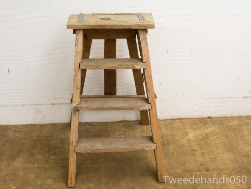 Rustic wooden step ladder with sturdy steps, perfect for home and workshop use.