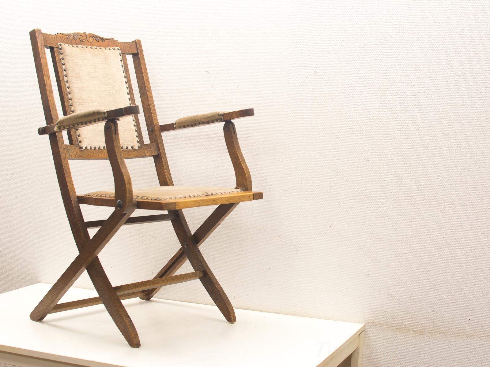 Elegant vintage wooden folding chair with fabric seat, perfect for any setting.