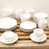 Elegant white vintage china set for special occasions, adding charm to any table setting.