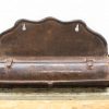 Antique wall letter holder with decorative scalloped edge and rustic charm for vintage decor enthusiasts.