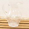Elegant vintage glass pitcher, perfect for serving drinks or as a stylish home accent.