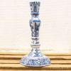Elegant blue and white ceramic candlestick showcasing exquisite traditional craftsmanship and floral motifs.