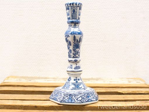 Elegant blue and white ceramic candlestick showcasing exquisite traditional craftsmanship and floral motifs.