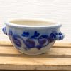 Elegant blue ceramic pot with handles, featuring intricate patterns for decorative and practical use.