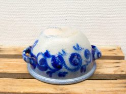 Charming ceramic bowl with cobalt blue floral patterns, perfect for serving or decoration.
