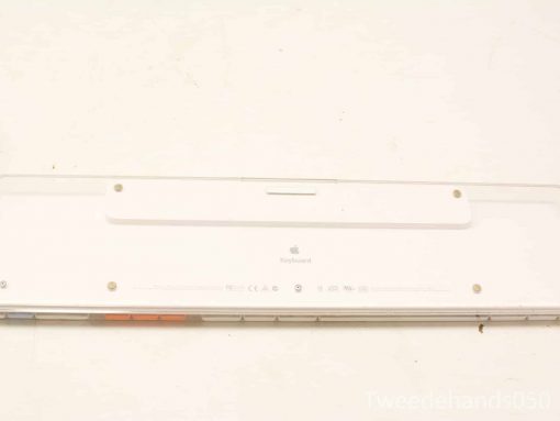Used Apple keyboard in white, featuring minimalist design, logo, and durable construction.