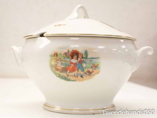 Elegant vintage porcelain tureen with hand-painted children in a picturesque landscape scene.