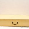 Charming vintage wooden storage box, pale yellow, rustic patina, perfect for organizing keepsakes.