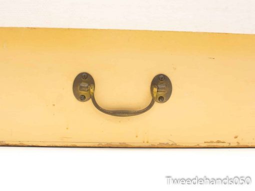 Vintage yellow box with elegant metal handle, perfect for retro decor enthusiasts.