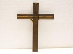 Rustic handcrafted wooden cross symbolizing faith with dark finish and lighter wood accents.