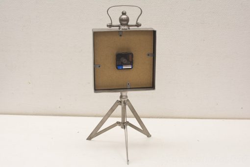Antique photo projector on tripod, showcasing vintage design and craftsmanship for photography enthusiasts.