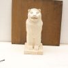 Majestic lion statue with a friendly expression, ideal for collectors and art enthusiasts.