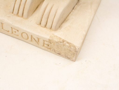 Unique off-white Leone sculpture with texture and character, showcasing organic, layered forms.