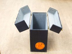 Elegant black vintage storage box with compartments and a striking orange sticker.