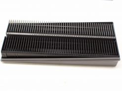 Professional dual comb grooming tool for precise pet grooming with measurement markings.