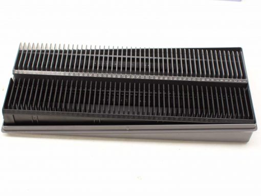 Professional dual comb grooming tool for precise pet grooming with measurement markings.