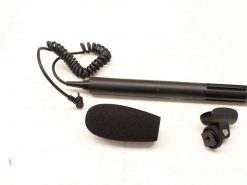 Professional microphone set with foam windscreen, coiled cable, and versatile mount for optimal audio recording.