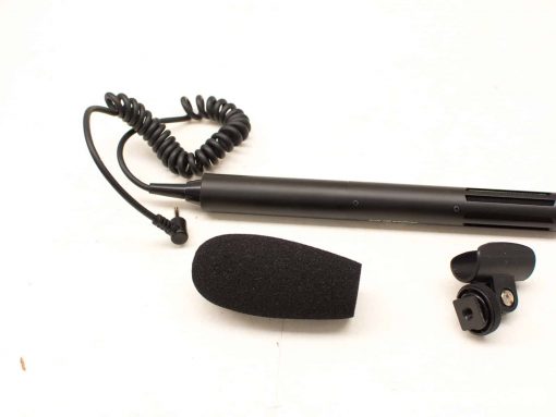 Professional microphone set with foam windscreen, coiled cable, and versatile mount for optimal audio recording.