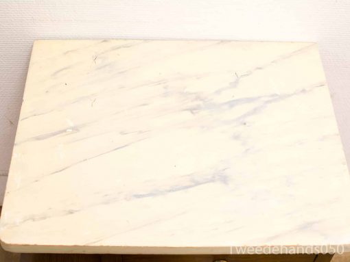 Elegant cream marble tabletop with subtle gray veins, perfect for stylish interiors.