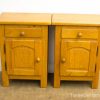 Vintage wooden nightstands with storage, perfect for complementing any bedroom decor.