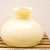 Charming vintage yellow vase with scalloped rim, perfect for decor or floral arrangements.