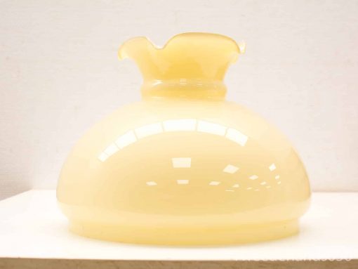 Elegant milky yellow vase with a graceful design, perfect for decoration or flower arrangements.