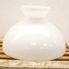 Stylish white glass lamp with rustic wooden base, perfect for enhancing any interior decor.