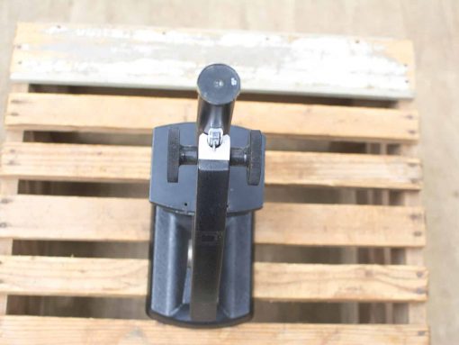 Durable black hand tool on wooden pallet, perfect for clamping and versatile applications.